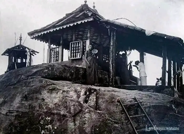 Historical photo of Sri Pada peak with surrounding landscape.