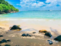 Close view of Mini Jungle Beach, Sri Lanka. Photo by Sameera Marapperuma. Close view of Mini Jungle Beach in Sri Lanka with clear waters and sandy shore.