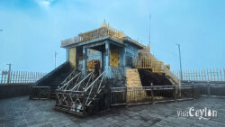 Sri Pada Udamaluwa Ratnapura entrance – Photo by Sameera Marapperuma Sri Pada Udamaluwa Ratnapura entrance with traditional structures and mountain surroundings.