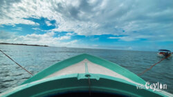 Boat Ride to Baththalangunduwa – Photo by Sameera Marapperuma A boat ride to Baththalangunduwa with travelers moving across calm ocean waters.