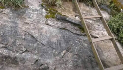 Ancient iron ladders of Sri Pada visible after a landslide Ancient iron ladders of Sri Pada exposed after a landslide along the mountain trail.