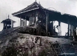 Old photo of Sri Pada peak Historical photo of Sri Pada peak with surrounding landscape.