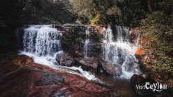 Paradise Falls – Photo by Sameera Marapperuma Paradise Falls cascading down surrounded by lush greenery.
